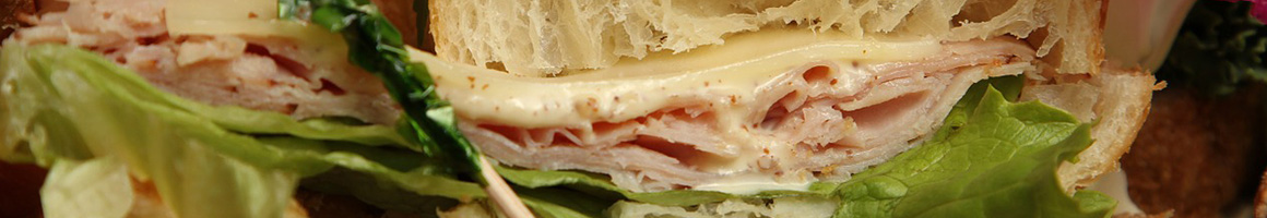 Eating Deli Italian Sandwich at Casella's Italian Delicatessen restaurant in Scottsdale, AZ.